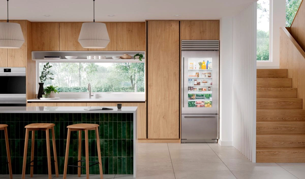Stainless steel Subzero fridge stocked with food
